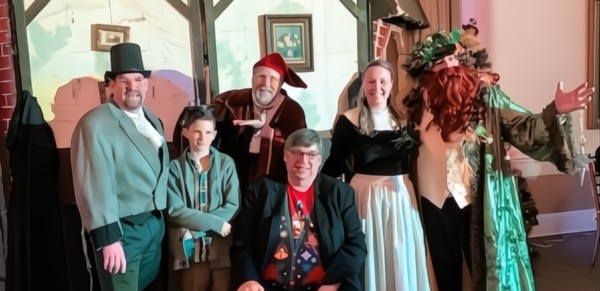 Riddlesbrood actors performing A Christmas Carol for a senior audience at a holiday event in New Jersey